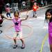 Ann Arbor residents Jane Slocum, 6, and Maya Max, 7, play with Hula-Hoops on top of chalk drawings during the Taste of Ann Arbor on Sunday, June 2. Daniel Brenner I AnnArbor.com